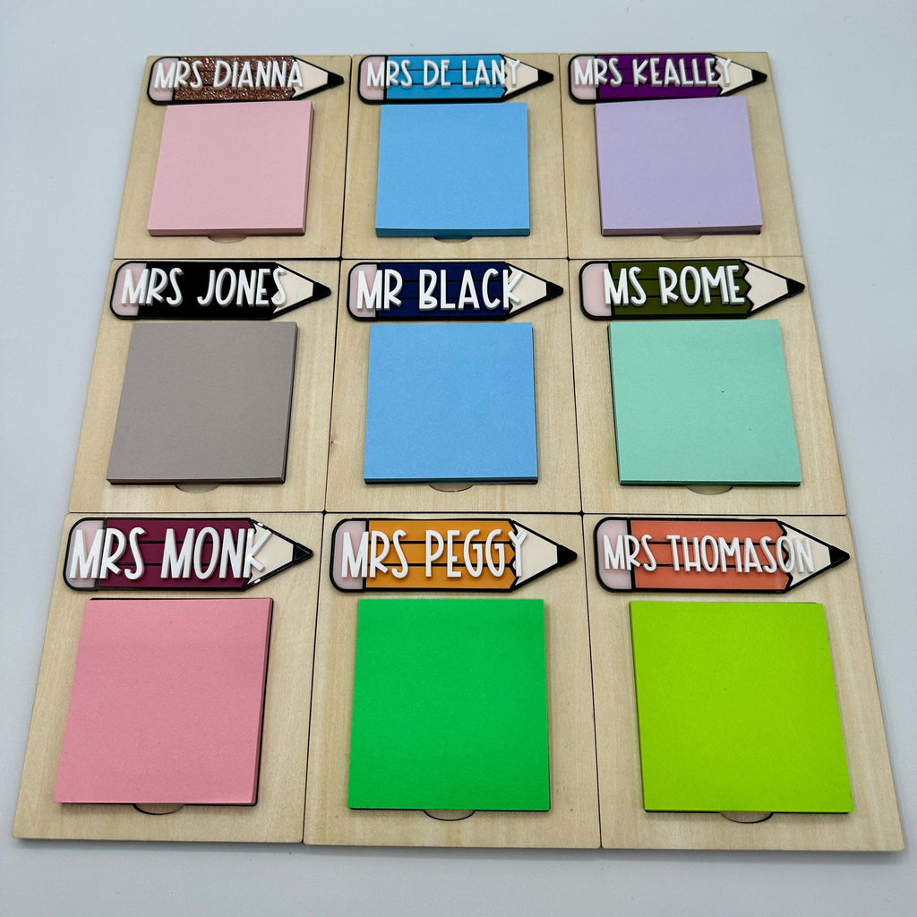 Custom Teacher Sticky Note Pad Holder| Custom Gift For Teachers| Last Day of School Gift | Teacher Appreciation Gift| Office Supplies|

May include: Nine wooden pencil holders with sticky note pads. Each holder has a colorful pencil with a name written on it. The names are: Mrs. Dianna, Mrs. De Lant, Mrs. Kealley, Mrs. Jones, Mr. Black, Ms. Rome, Mrs. Monk, Mrs. Peggy, and Mrs. Thomason.