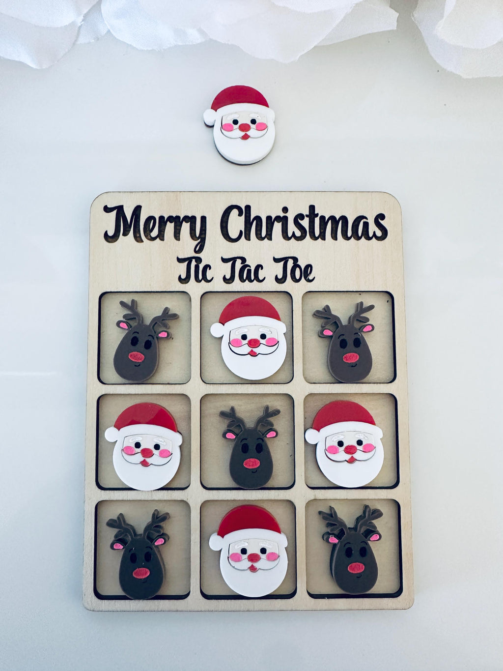 Add some holiday cheer to your game night! 🎅🏼 This Christmas Tic Tac Toe board features adorable gingerbread men and women made from layered Acrylic on a sturdy ¼” maple wood base. Perfect for gifting, classroom fun, or cozy nights by the tree — includes a velvet storage bag for easy keeping.