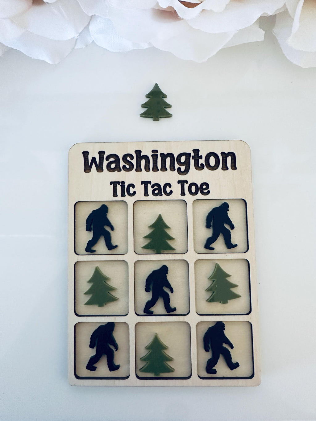Celebrate the beauty of Washington State with this handmade Tic Tac Toe game featuring iconic apples and orcas! Crafted from maple wood and premium Acrylic, this board is the perfect keepsake, gift, or travel-friendly family game. Includes a velvet storage bag for easy carrying.