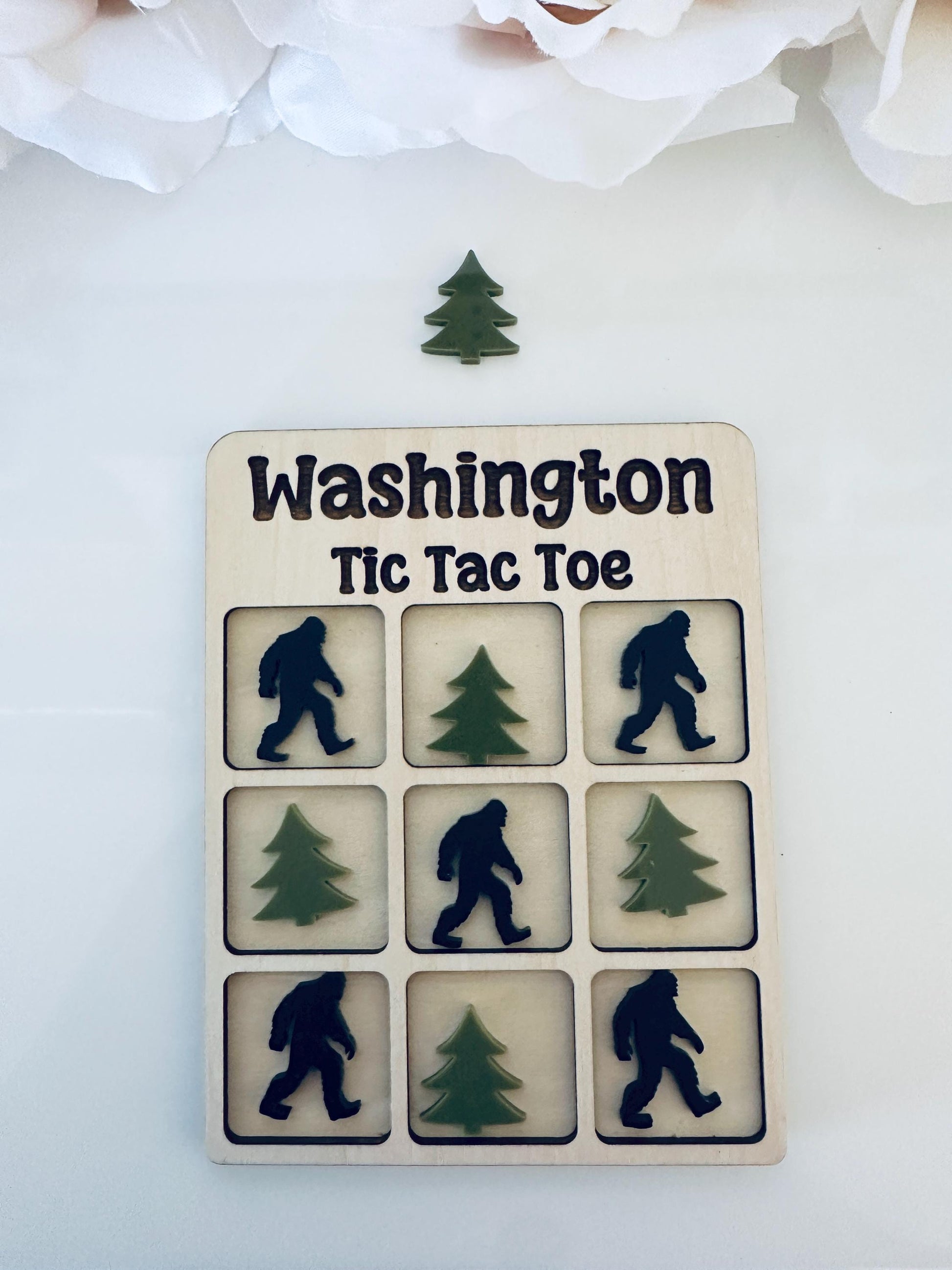Celebrate the beauty of Washington State with this handmade Tic Tac Toe game featuring iconic apples and orcas! Crafted from maple wood and premium Acrylic, this board is the perfect keepsake, gift, or travel-friendly family game. Includes a velvet storage bag for easy carrying.
